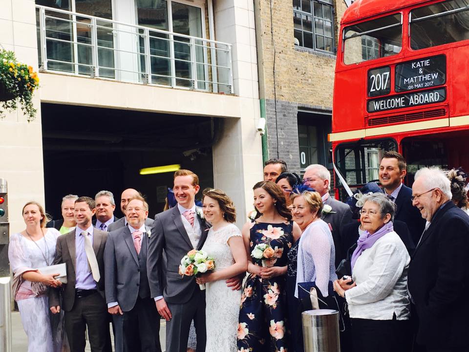 Wedding guests outside the classic routemaster bus